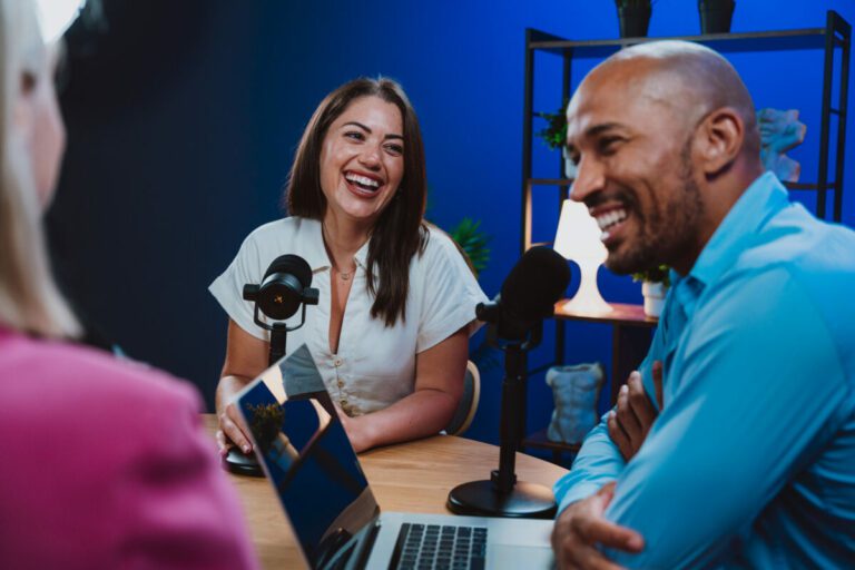 Group of three hosts is capturing a live audio broadcast